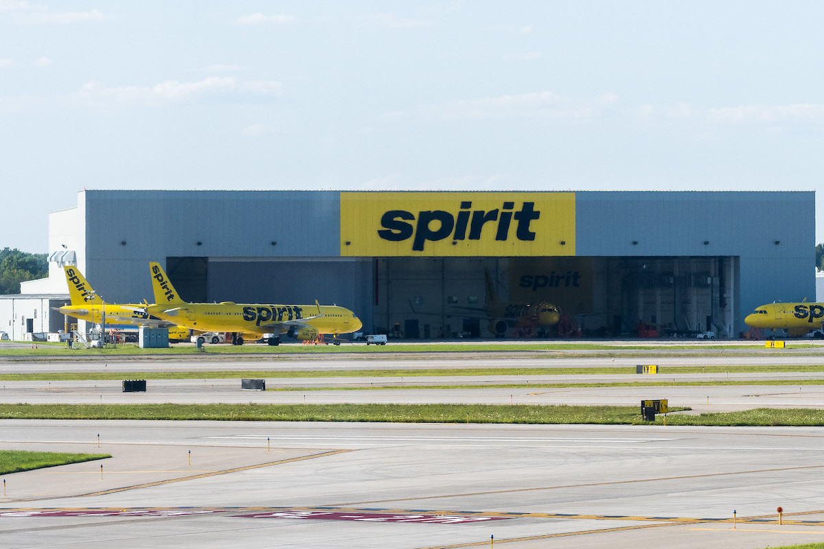 Spirit Airlines planes parked at a hangar at the Detroit airport