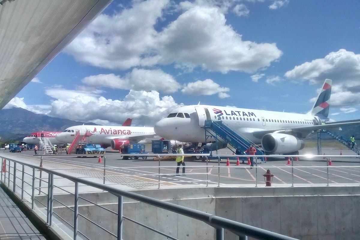 Avianca and Latam planes at an airport in Colombia.