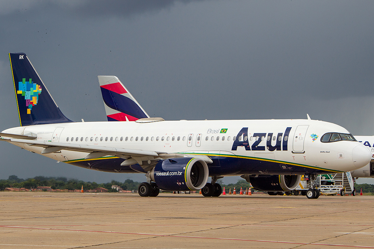 An Azul aircraft in front of a Latam Airlines plane